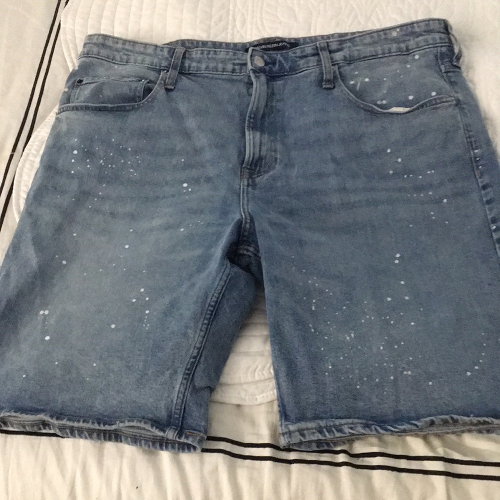Calvin Klein paint splatter Blue Jean shorts.